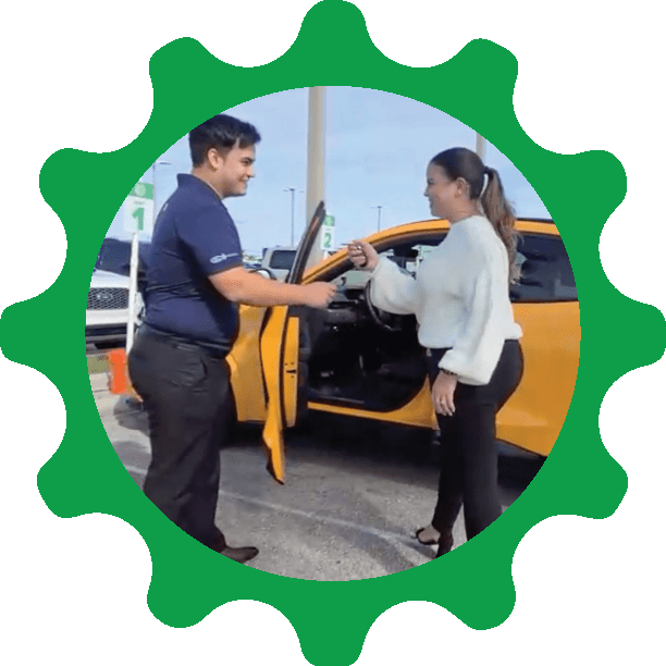 Salesman handing customer the keys